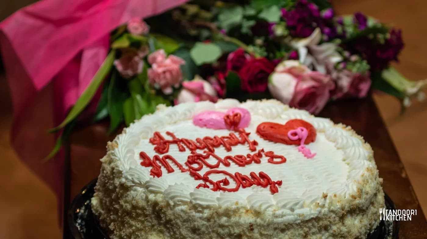 A Happy Mother's Day cake with fresh roses