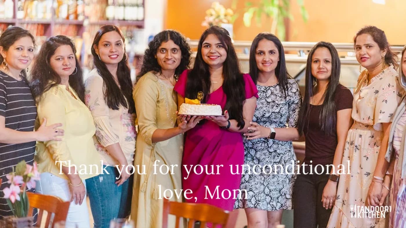 A Mother's Day group celebrating with cake